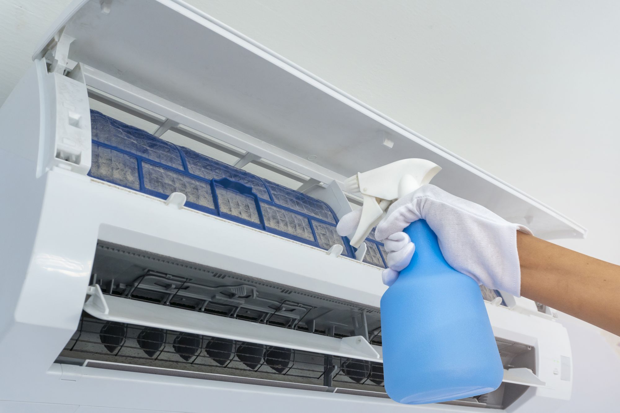 Cleaning dirty air filter inside air conditioners.With Water spr